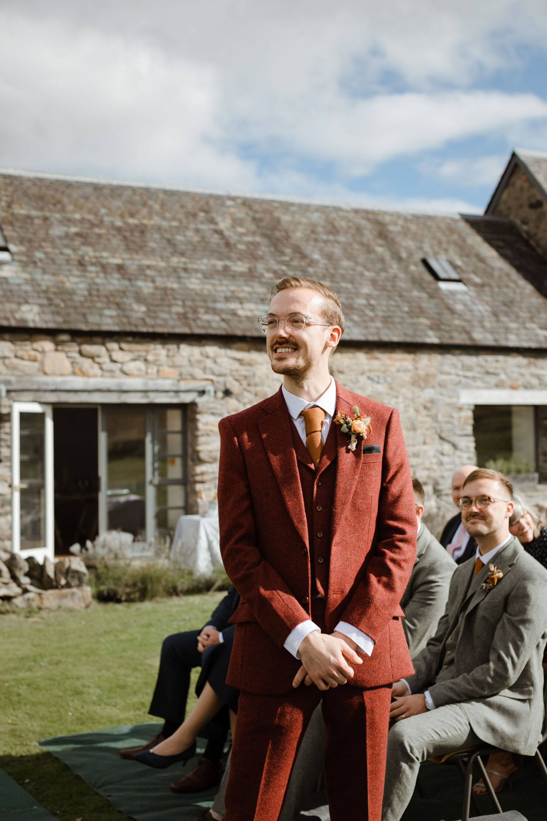 Groom in Auburn wedding suit