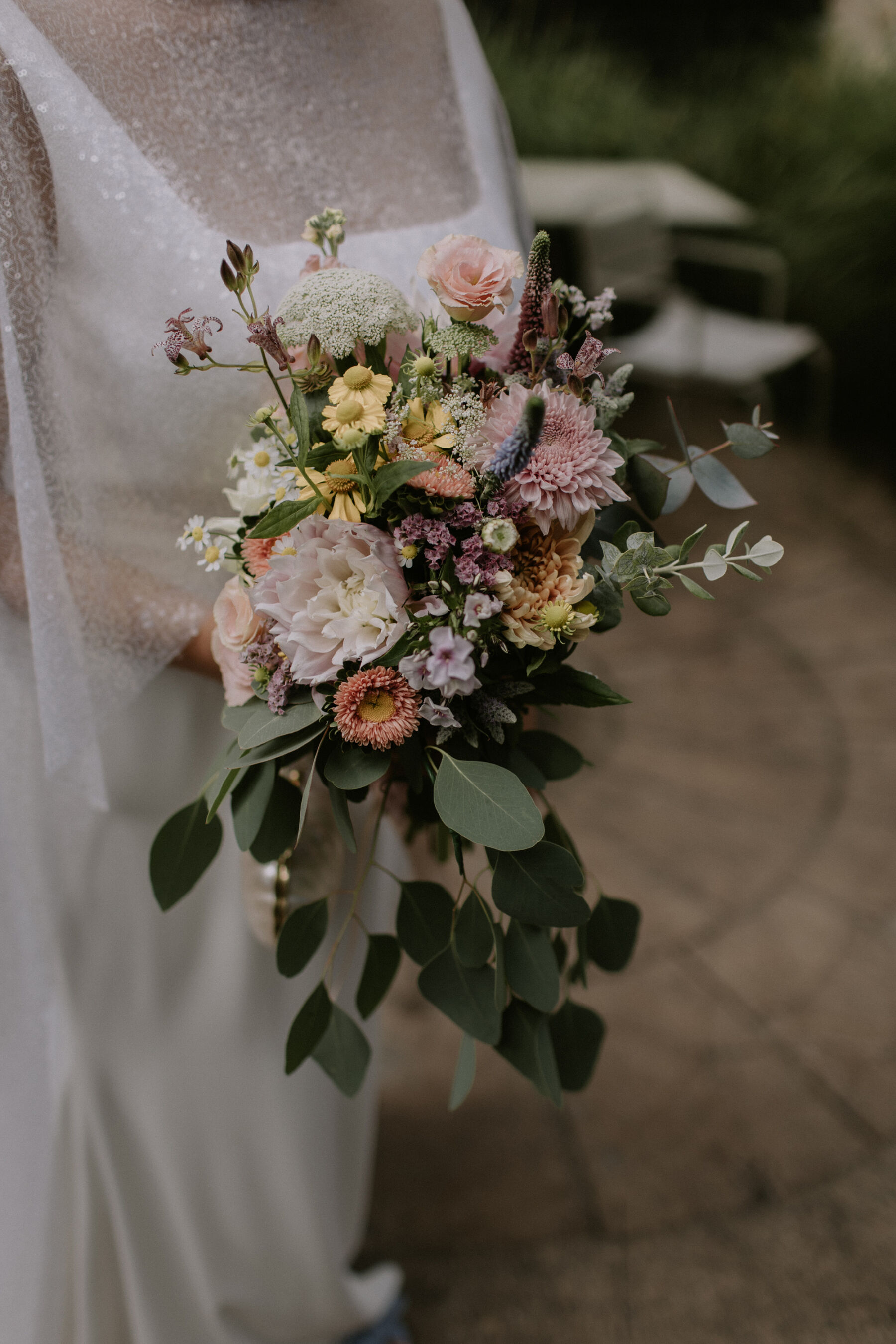 Beautiful summer wedding bouquet with dahlia and eucalyptus 