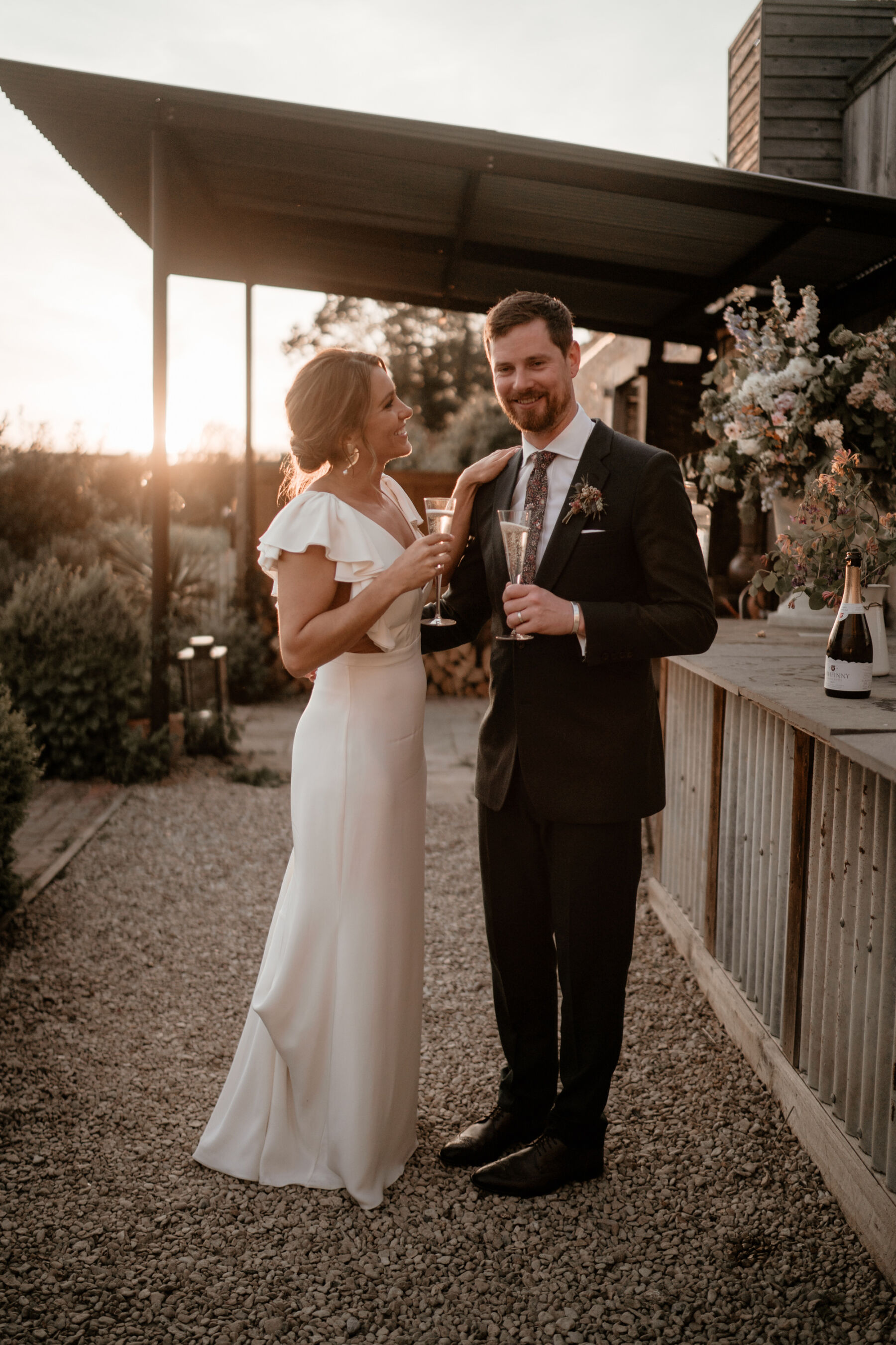 Bride holding glasses of champagne