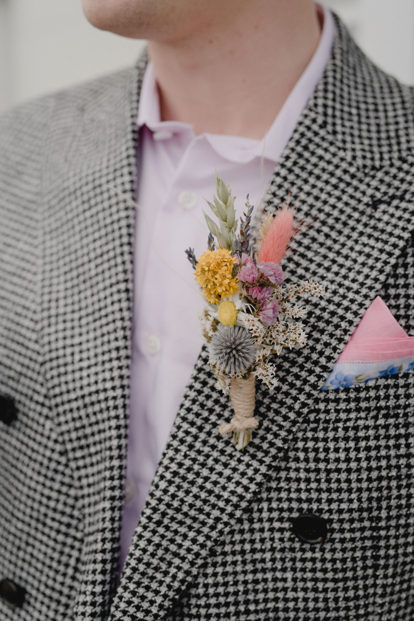 Dried flower and pink died grasses buttonhole.