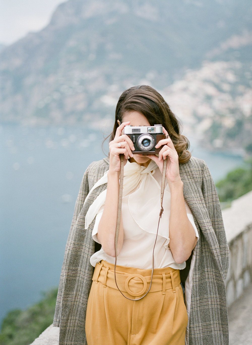 wife snaps a photo in Positano