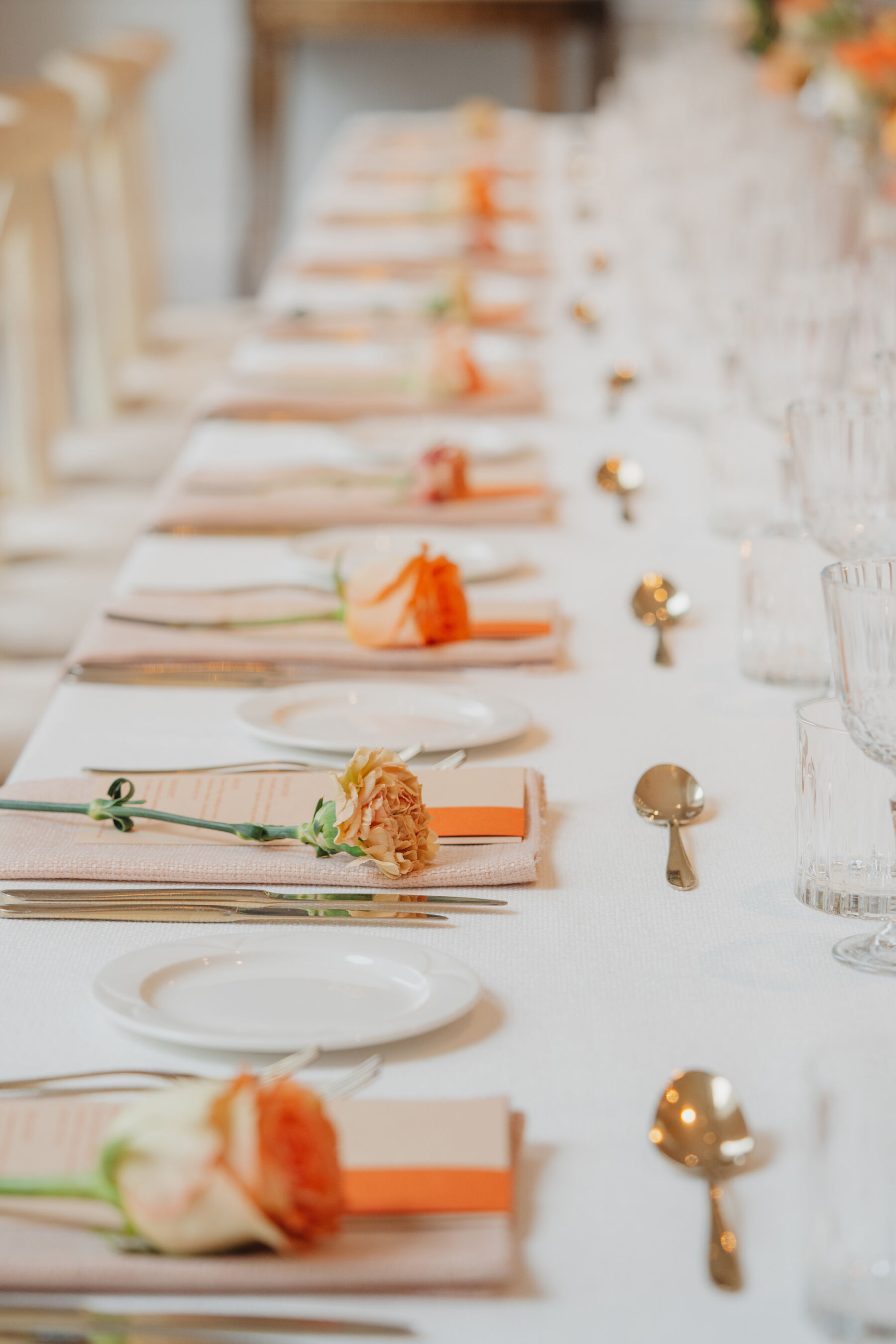How to Create a Beautiful Sustainable Wedding on a Small Budget, with 41 Portland Place, London 15 Single stem roses and gold cutlery.