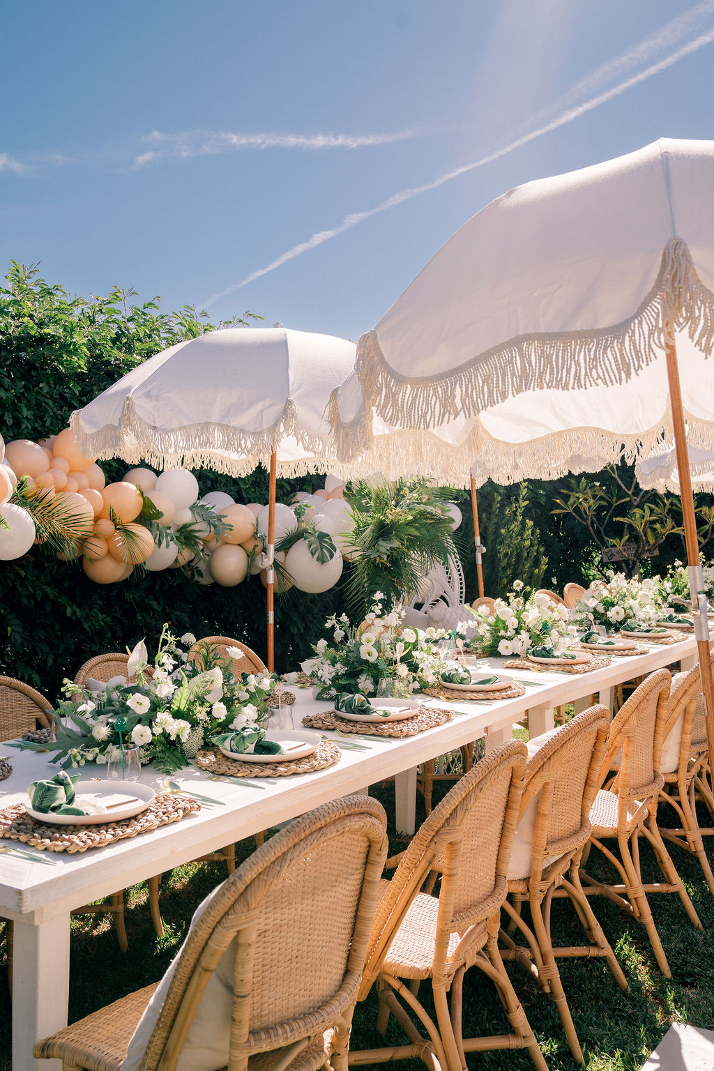 unique tropical wedding and bridal shower themes with boho fringe umbrella decor ideas for a small backyard gathering