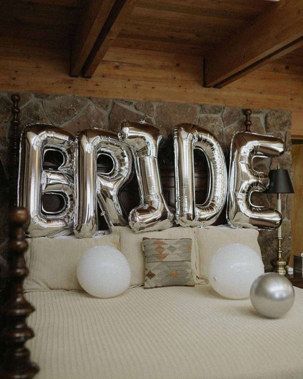 low key mountain cabin destination winter bachelorette party ideas with "bride" balloon decorations