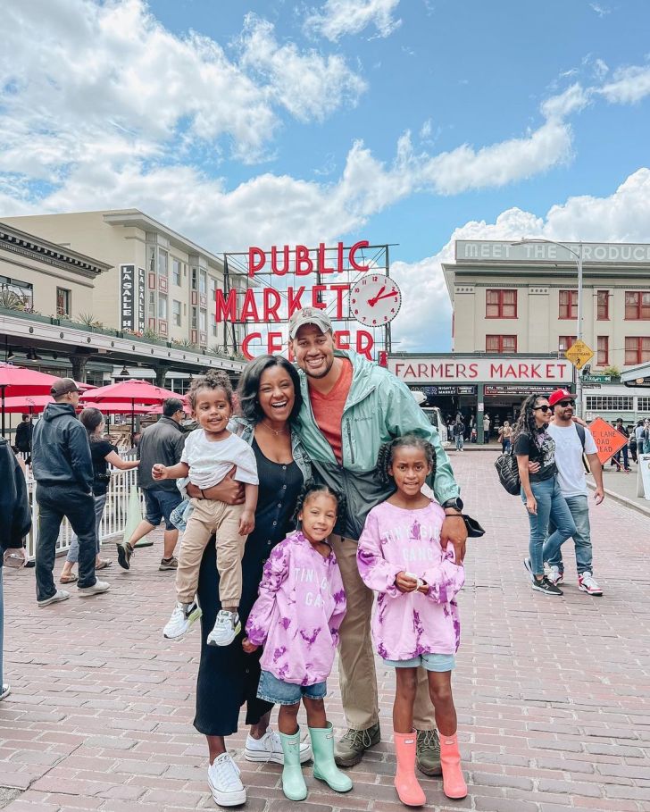 parents with young kids having fun at the Pike Place Market in Seattle Washington unique spring break destinations for families