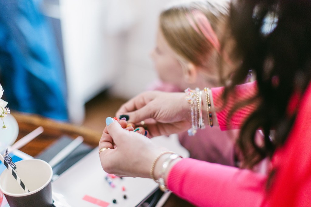 person making a friendship bracelet