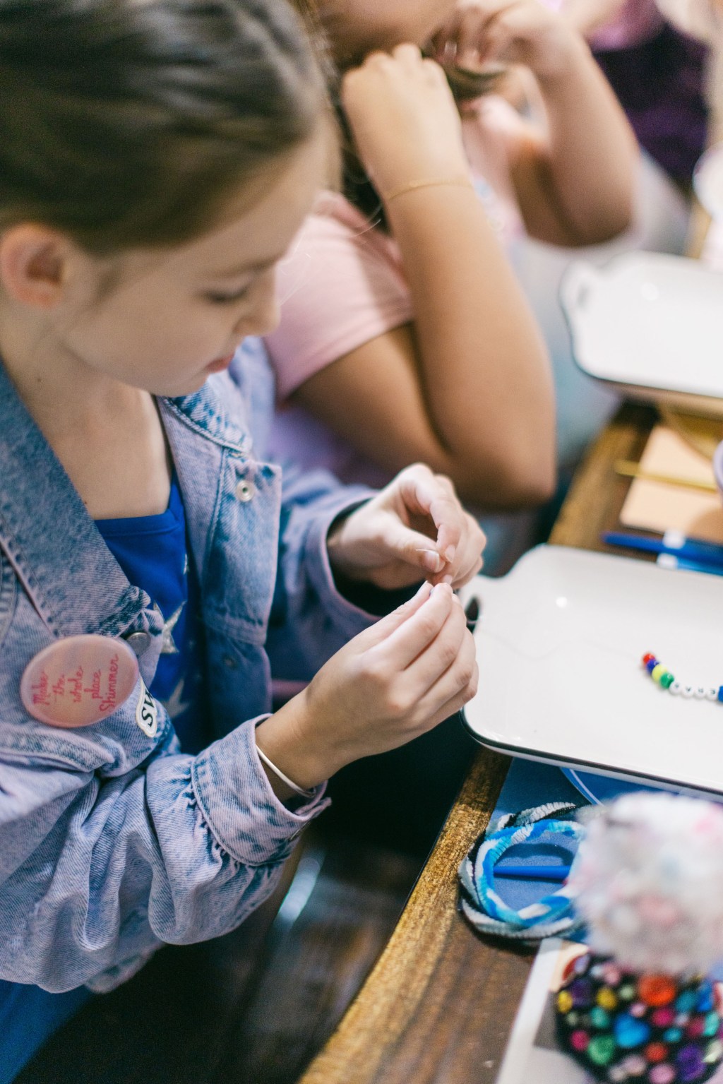 person making a friendship bracelet