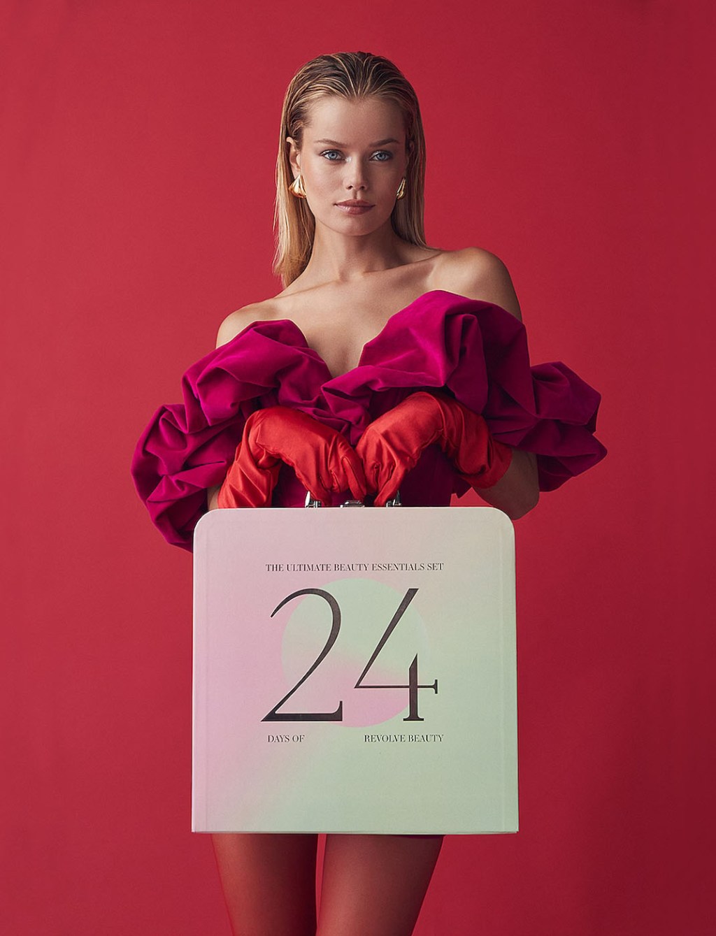 woman holding a briefcase that holds the Revolve Beauty 24 day best advent calendar for adults