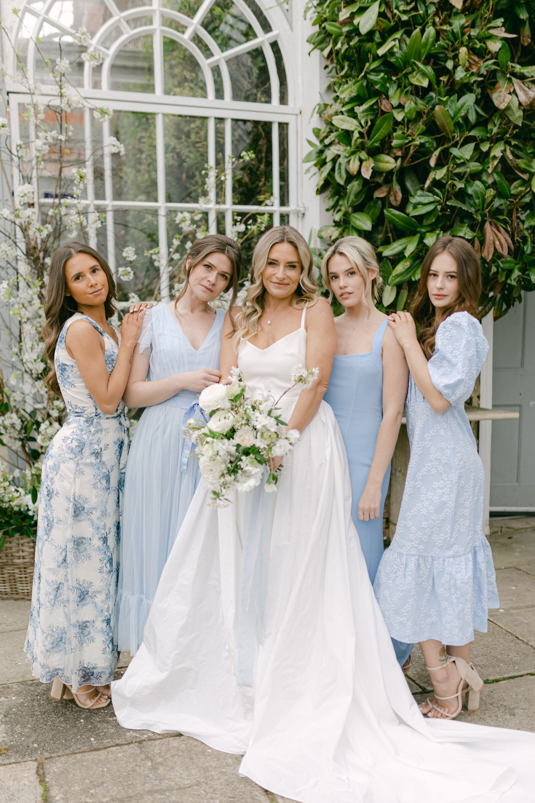 Pale Baby Blue Spring Wedding Inspiration at Avington Park, Featuring Halfpenny London 6 Bridesmaids in plain and patterned pale blue dresses and Bride in a Halfpenny London gown.