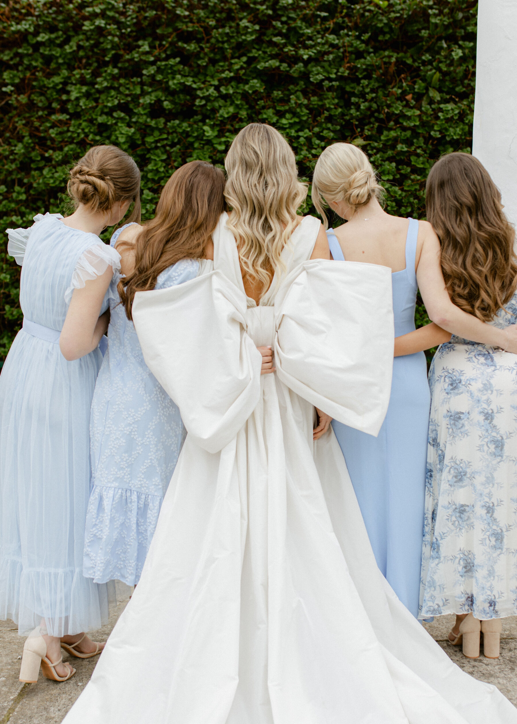 Pale Baby Blue Spring Wedding Inspiration at Avington Park, Featuring Halfpenny London 2 Halfpenny London wedding dress with large bow at the back. Bridesmaids