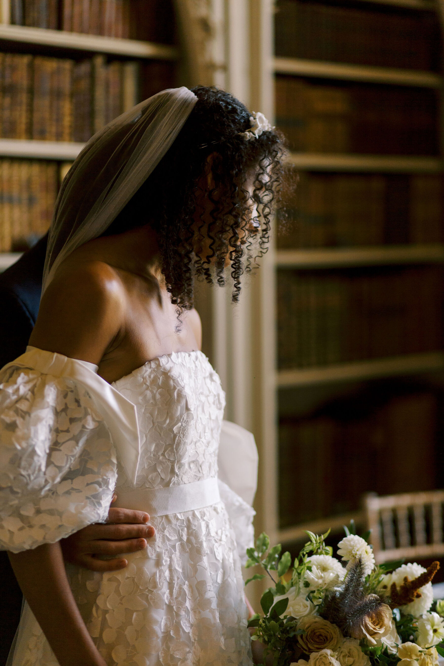 Gothic Architecture Inspired Wedding Styling, at Strawberry Hill House 18 Black modern bride with natural curly afro hair, wears a puff sleeve wedding dress by Sassi Holford. Helen Warner Photography.