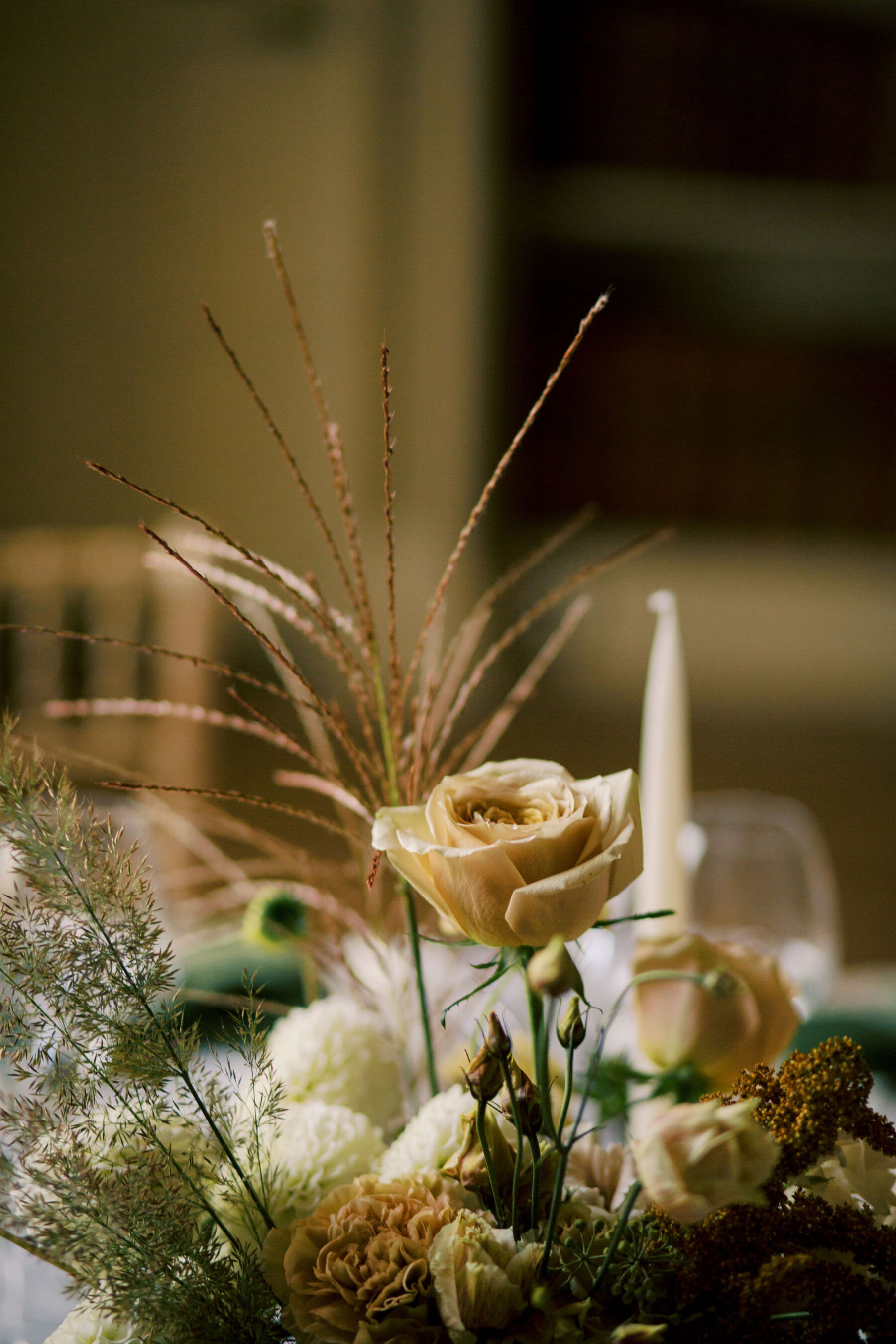 Gothic Architecture Inspired Wedding Styling, at Strawberry Hill House 13 Elegant modern wedding table flowers in neutral and toffee tones, with grasses and tall taper candles. Helen Warner Photography.