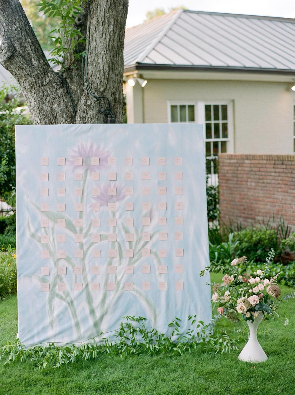 custom handprinted floral escort card wall