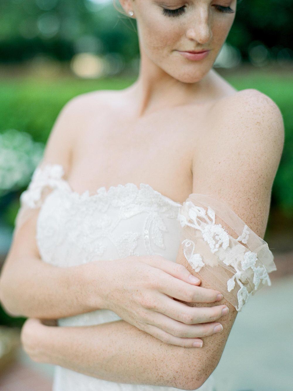 romantic bridal gown with soft off-the-shoulder sleeves
