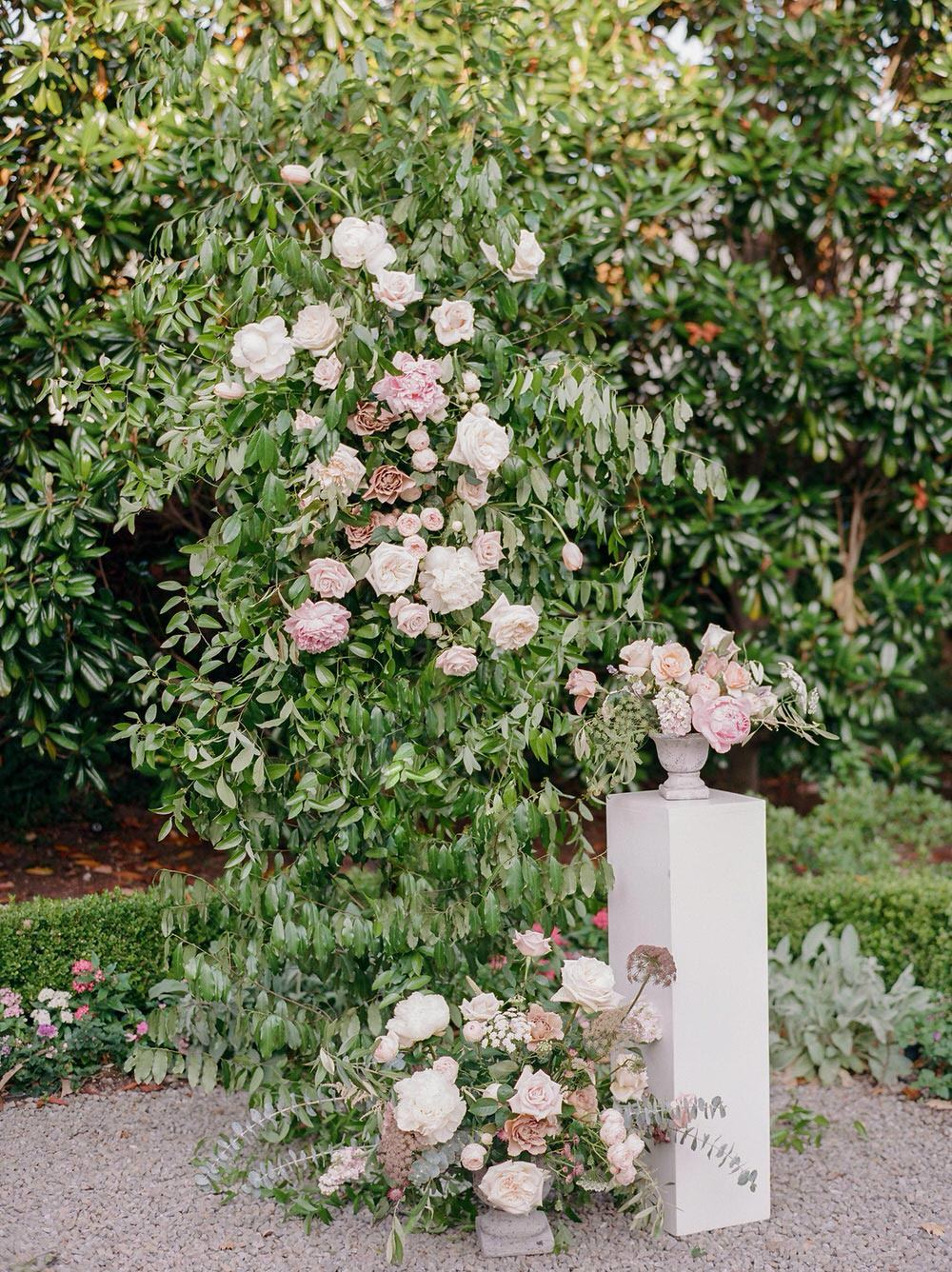 garden wedding ceremony with oversized floral arrangements and peonies