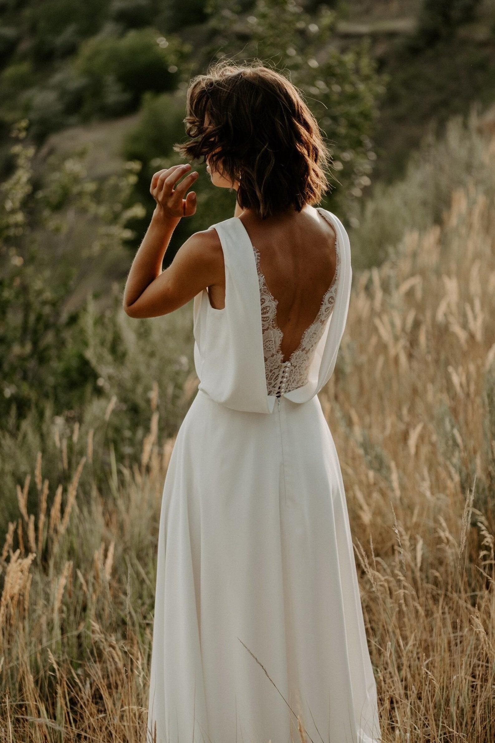 sleeveless v-neck wedding dresses with an open lacy back