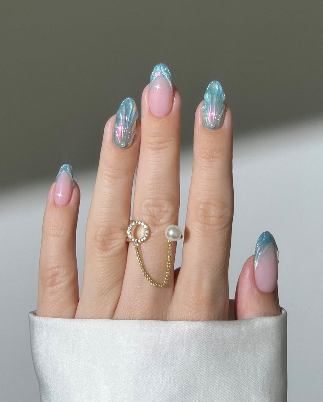 3D french tip mermaid nails with shimmery beach inspired blue nail polish colors