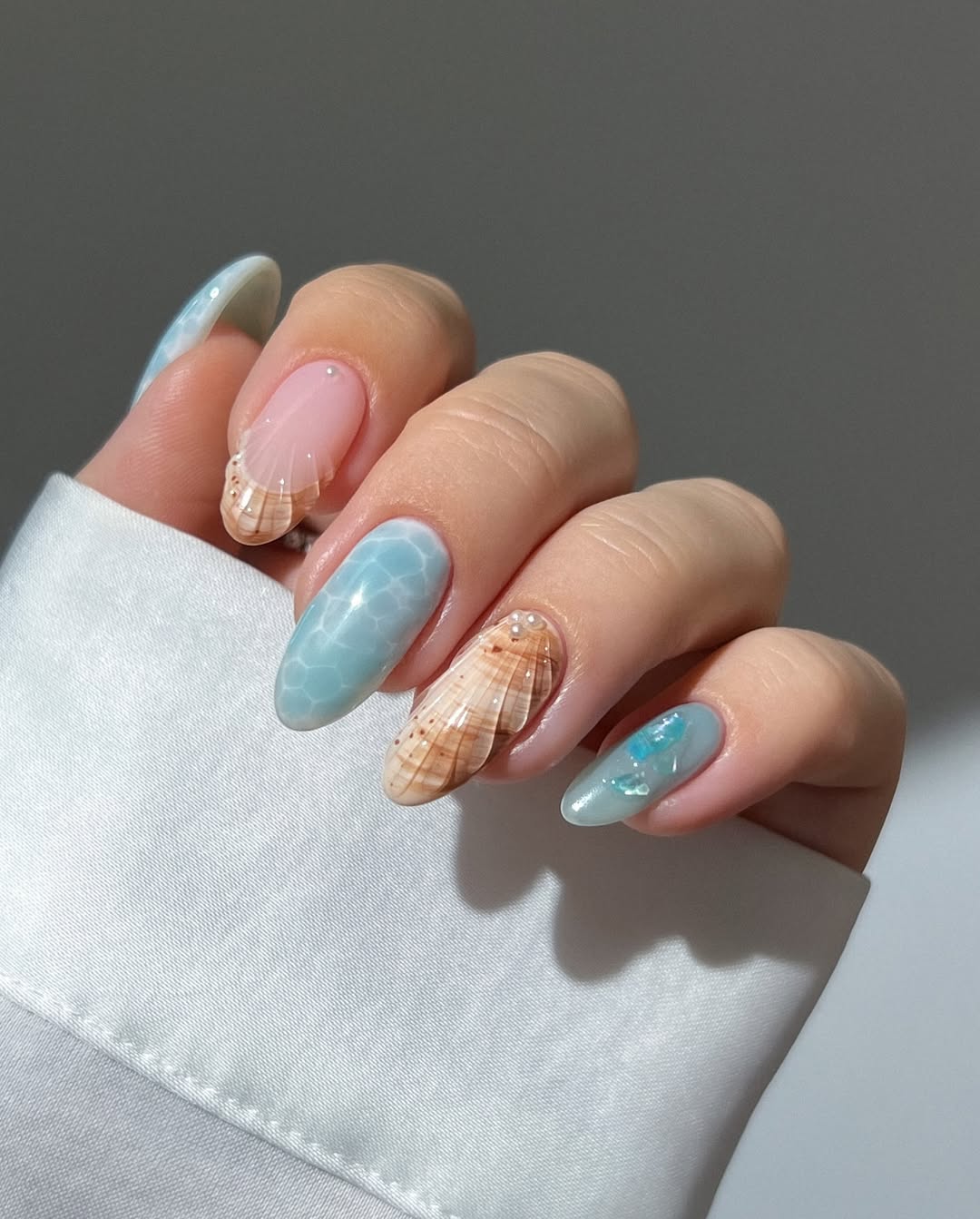 3D mermaid beach nail ideas for a 2025 ocean vacation with seashell designs and light blue colors